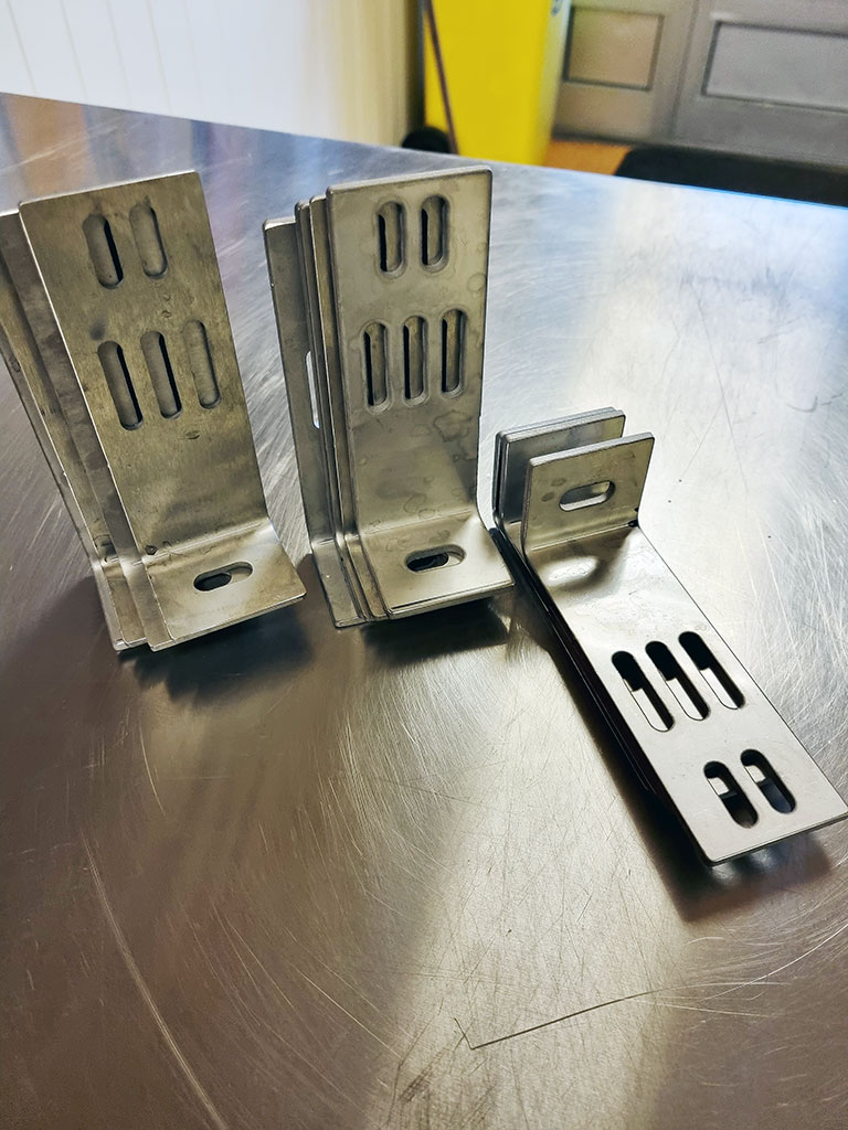 Various mounting brackets produced in stainless steel