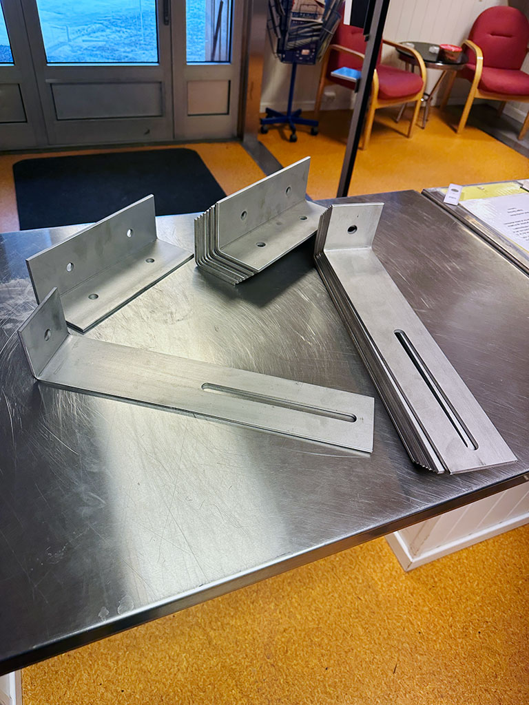 Various mounting brackets produced in stainless steel